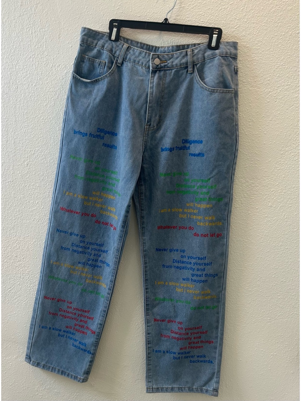 Light Blue Wide-Leg Jeans with Multicolor Text Print